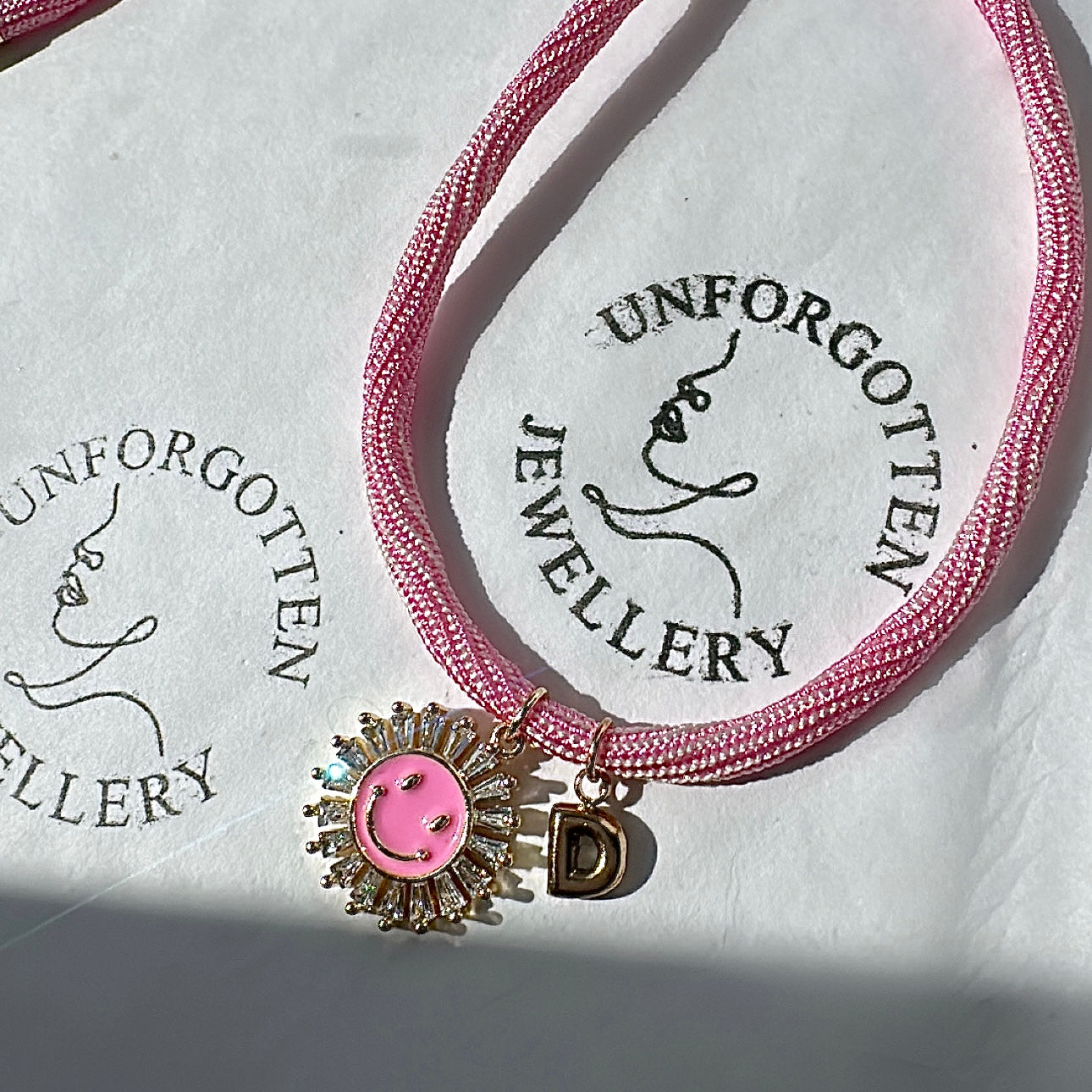 Bubblegum smiley initial necklace